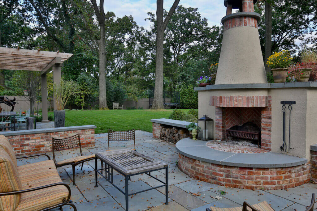 A backyard oasis fireplace created by Landbox Landscape Architecture Studio